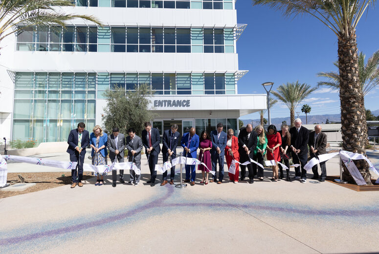 LLUH and government officials cut ribbon in front of specialty clinics building