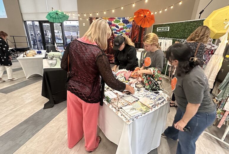 event attendee peruses vendor items