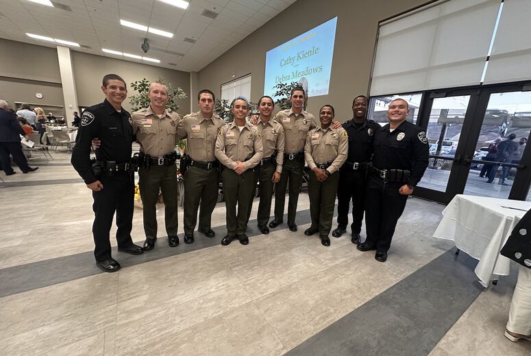 group of law enforcement officers pose for photo