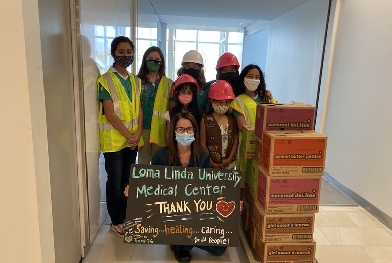 Girl Scouts deliver cookies to hospital