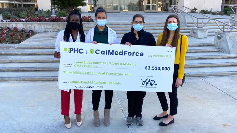 LLUH residents accept check from Cal Med Force