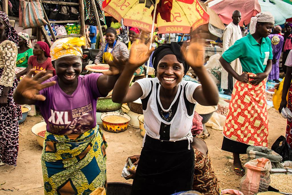 Nigerian women having fun in the marketplace.