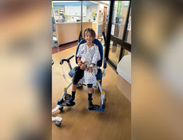 Samuel Rodriguez smiles in wheelchair at hospital 