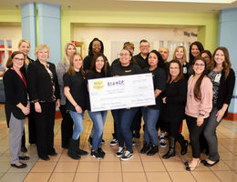 Loma Linda University Children’s Hospital presented with nearly $48,000 donation from Spirit of Children group stands with check for photo