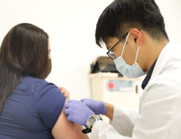 Doctor preps a patient for a flu vaccine 