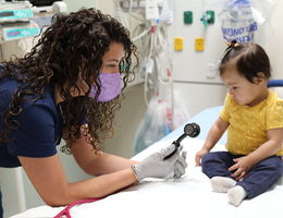 female doctor with toddler patient