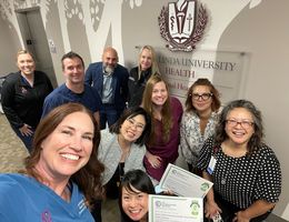 a group of hospital employees taking a selfie