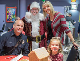 Loma Linda University Children's Hospital patients decorate gingerbread houses alongside local firefighters