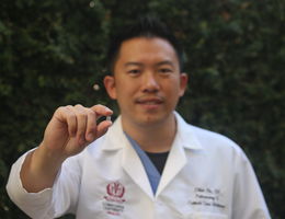 Dr. Ho holding the tiny BLVR valve