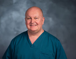 Lance Brown headshot in scrubs