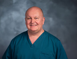 Lance Brown headshot in scrubs