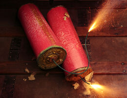 two burning firecrackers
