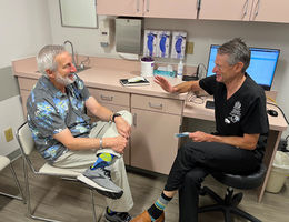 Urologist Herbert Ruckle, MD, ensures patients obtain access to factual information about prostate cancer. Dr. Ruckle consults with a patient in clinic