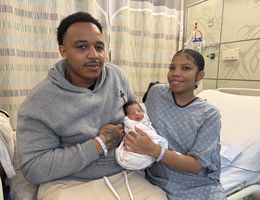 Parents Eric King and Alise Bailey hold their newborn, Carter King, who was born on New Year's Day at Loma Linda University Children's Hospital