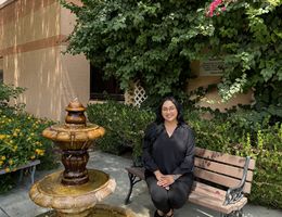 Paola Vidauri Luna sitting outside of the behavioral health center