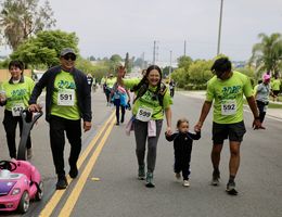 Family walking toward the finish line