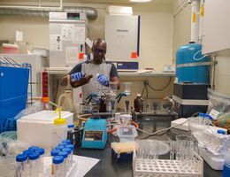 Thomas Hile, PhD, MSc, an LLU affiliated researcher, prepares water samples for testing in a laboratory.