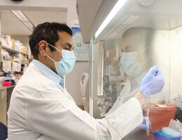 Dr, Hisham Abdel-Azim working in a clinical science lab