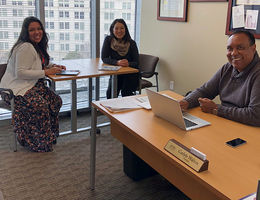 Loma Linda University Health expects to have greater impact on federal policy in 2019 Two women and one man sit in office with large window