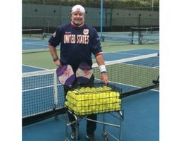 Greg Johnson poses on pickleball court