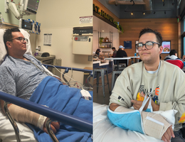A man in a hospital bed sits with a broken wrist in a cast. 