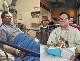 A man in a hospital bed sits with a broken wrist in a cast. 