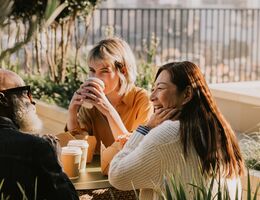 A group of coworkers enjoy an outdoor lunch