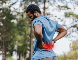 Portrait of a mature man with back pain 
