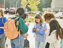 Medium wide shot middle school friends hanging out after school