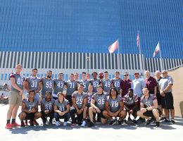 University of Redlands football team visits pediatric patients