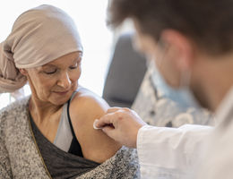 Patient with cancer receiving vaccination