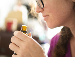 Woman smelling an essential oil