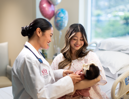 Doctor with mother and baby