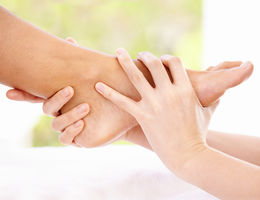 hand holding foot