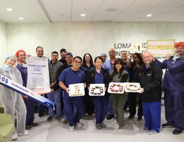 a group of medical employees pose for a photo