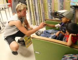 Patients at LLUCH outpatient clinic treated to visit from UCLA football players