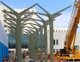 Workers adding final features to future entrance area