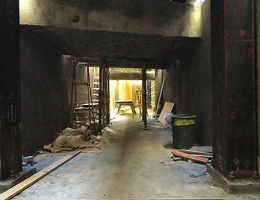 Workers open tunnel joining current hospital and new facilities at A level
