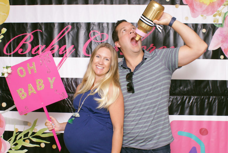 These expectant parents had some photobooth fun.