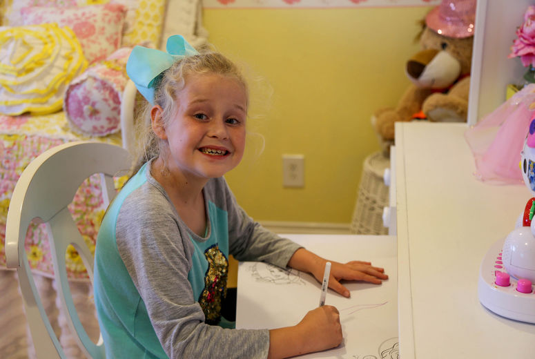 Sophia enjoys coloring, drawing and spending time with her new family. 