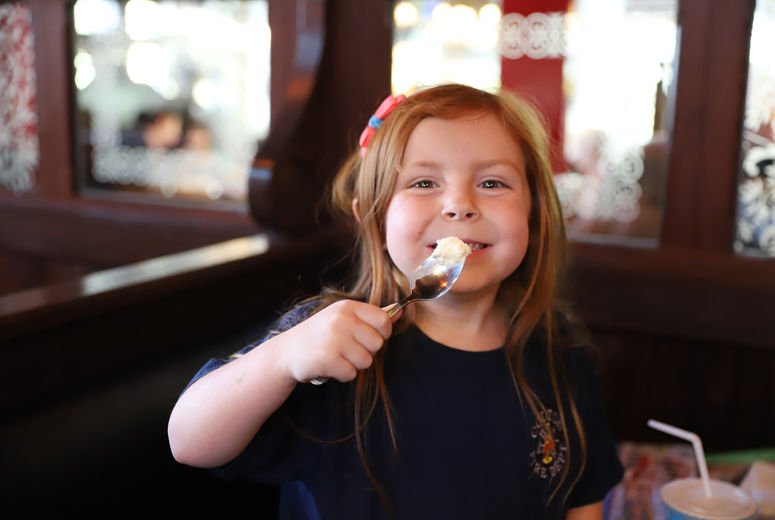 girl eating ice cream at The Old Spaghetti Factory restaurant
