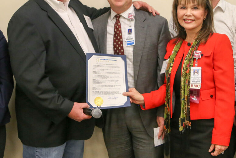 Jonathan Ingram, mayor of Murrieta presented LLUBMC's Edward Field, VP/Administrator of LLUBMC, and Marsha Mathews, program manager at LLUBMC, with a certificate of excellence.