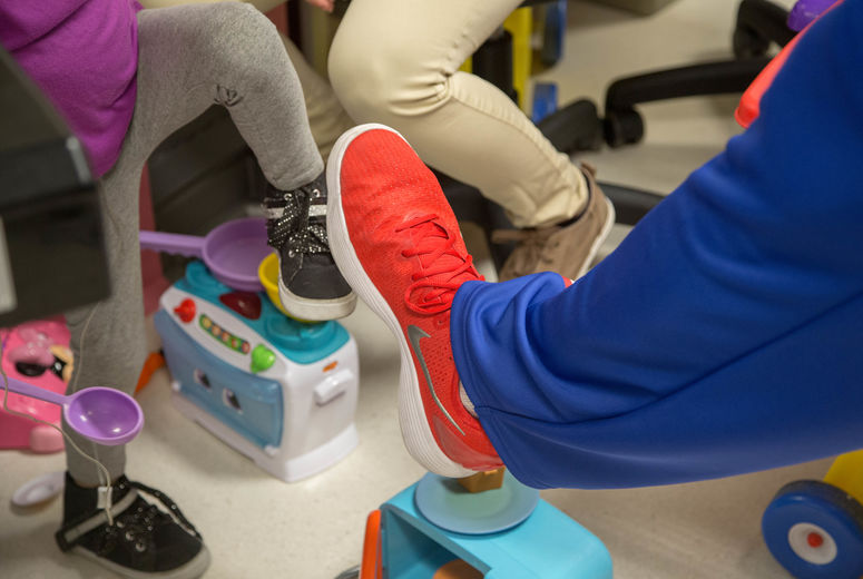 Harlem Globetrotter "El Gato" Melendez, 6'8", compares shoe sizes with a young patient. The Harlem Globetrotters brought Valentine's Day cheer to children at the Loma Linda University Children's Hospital Hematology/Oncology Clinic on Wednesday, February 14, 2018, in Loma Linda, California. 
