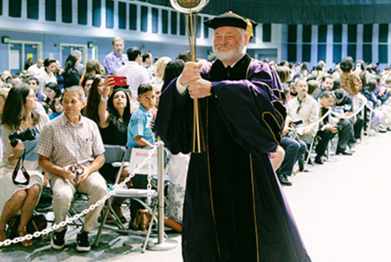 Provost Ronald L. Carter, PhD, led the procession into the auditorium carrying the traditional mace.