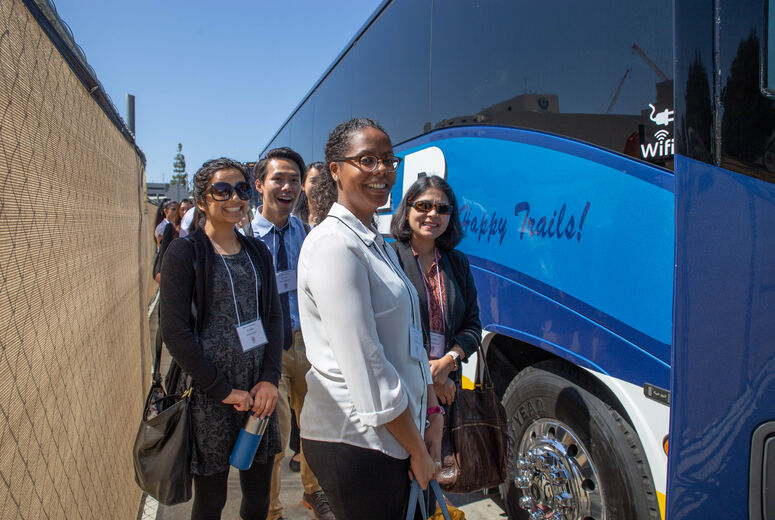 Resident physicians boarding a charter bus