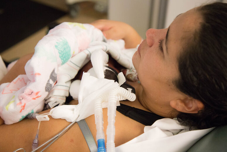 New mom Leticia Delgado holds her tiny baby, Emmarose Delgado, in the NICU at Loma Linda University Children’s Hospital.