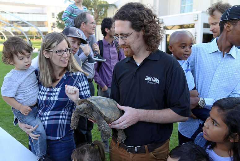 At the meet-and-greet, Eric Gren, PhD, introduced people to a Desert Tortoise.