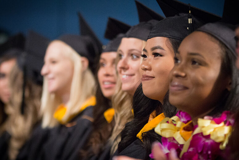Taking in the ceremony during the commencement for the Schools of Religion and Behavioral Health