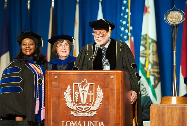 Shaunna Siler (left) received the School of Nursing Dean’s Award for PhD graduates from Dean Elizabeth Bossert, PhD, and Richard Hart, MD, DrPH, president of Loma Linda University Health.