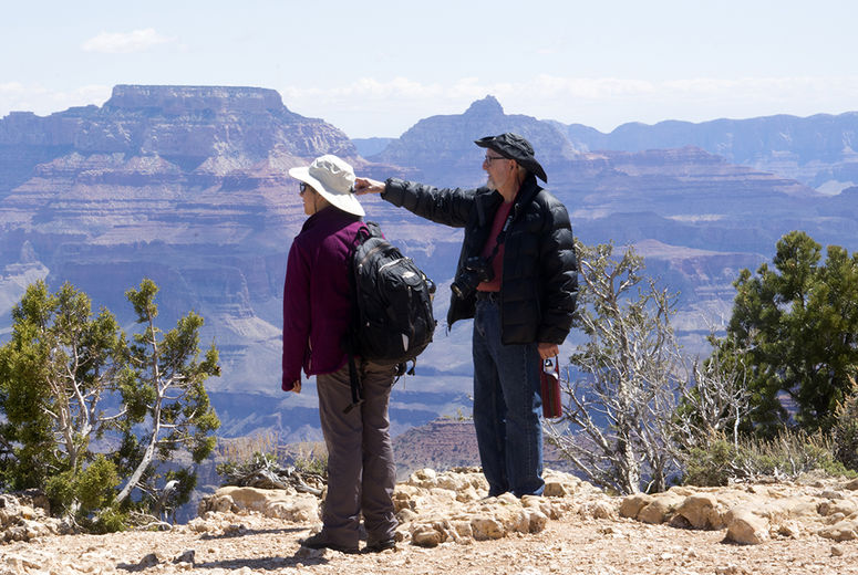 Leonard Brand and Sarah Maithel evaluate a distant layer of Coconino Sandstone from the South Rim of Grand Canyon National Park. 